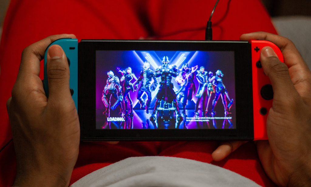 boy playing fortnite on nintendo switch console