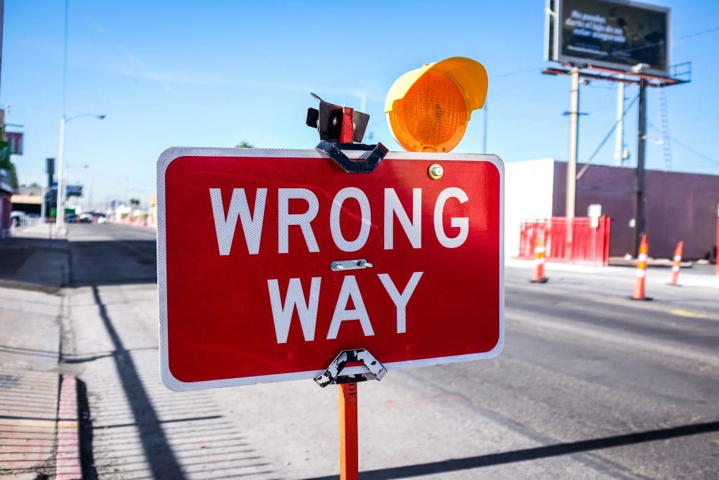 sign saying wrong way illustrating improving fortnite skills